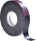 A roll of double-sided adhesive tape with black and red coating, brand HellermannTyton.