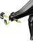 A black tool with an ergonomic handle is used to compress plastic clips. Two clips hover beside it.