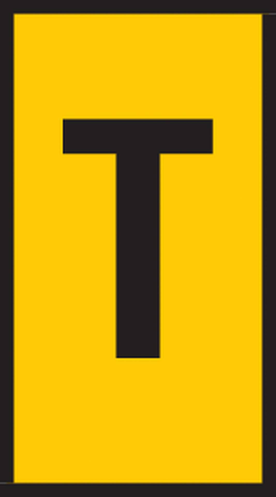 Yellow rectangular sign with a large black letter 'T' in the centre.