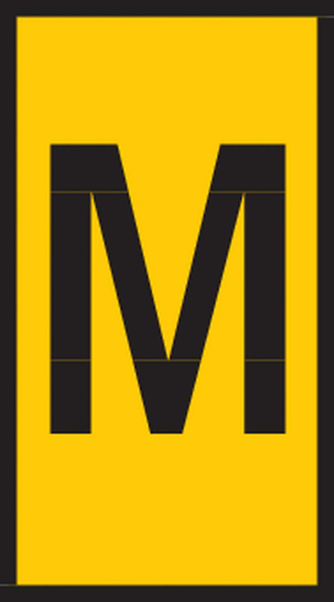 Yellow sign with a large black letter 'M' in the centre.
