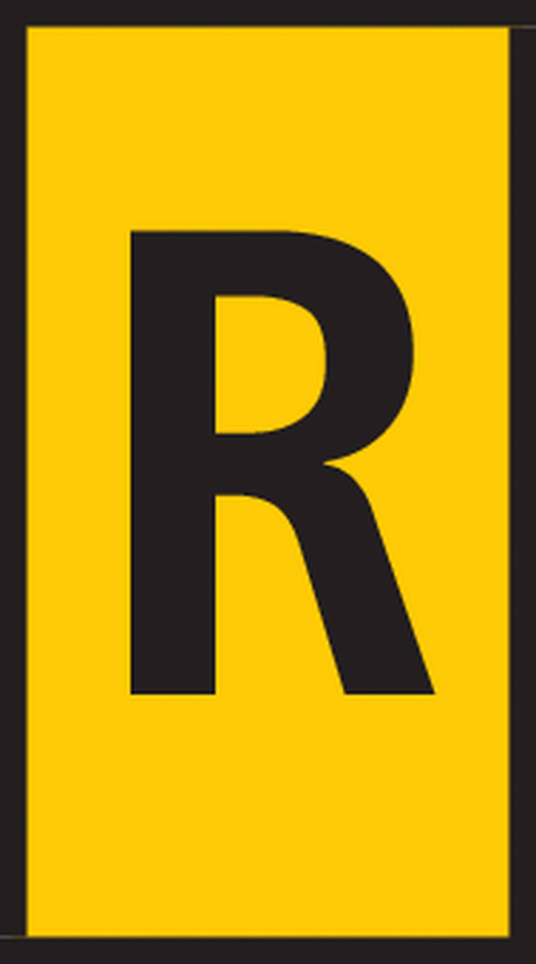 A yellow rectangular sign with a large black letter 'R' in the centre.