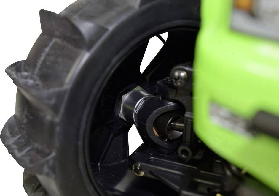 Close-up of a large black wheel tyre on a green agricultural vehicle. The focus is on the wheel hub and wheel structure.