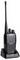 A black radio with an antenna and two rotary knobs, charged in a charging station. Brand: Alinco.
