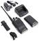 A two-way radio with charging station, battery, belt clip, power adapter and carrying strap. The devices are designed for professional use.