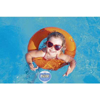 A small child wearing red sunglasses is swimming happily in an orange inflatable ring in the blue pool water. The temperature display shows 28.3°C.
