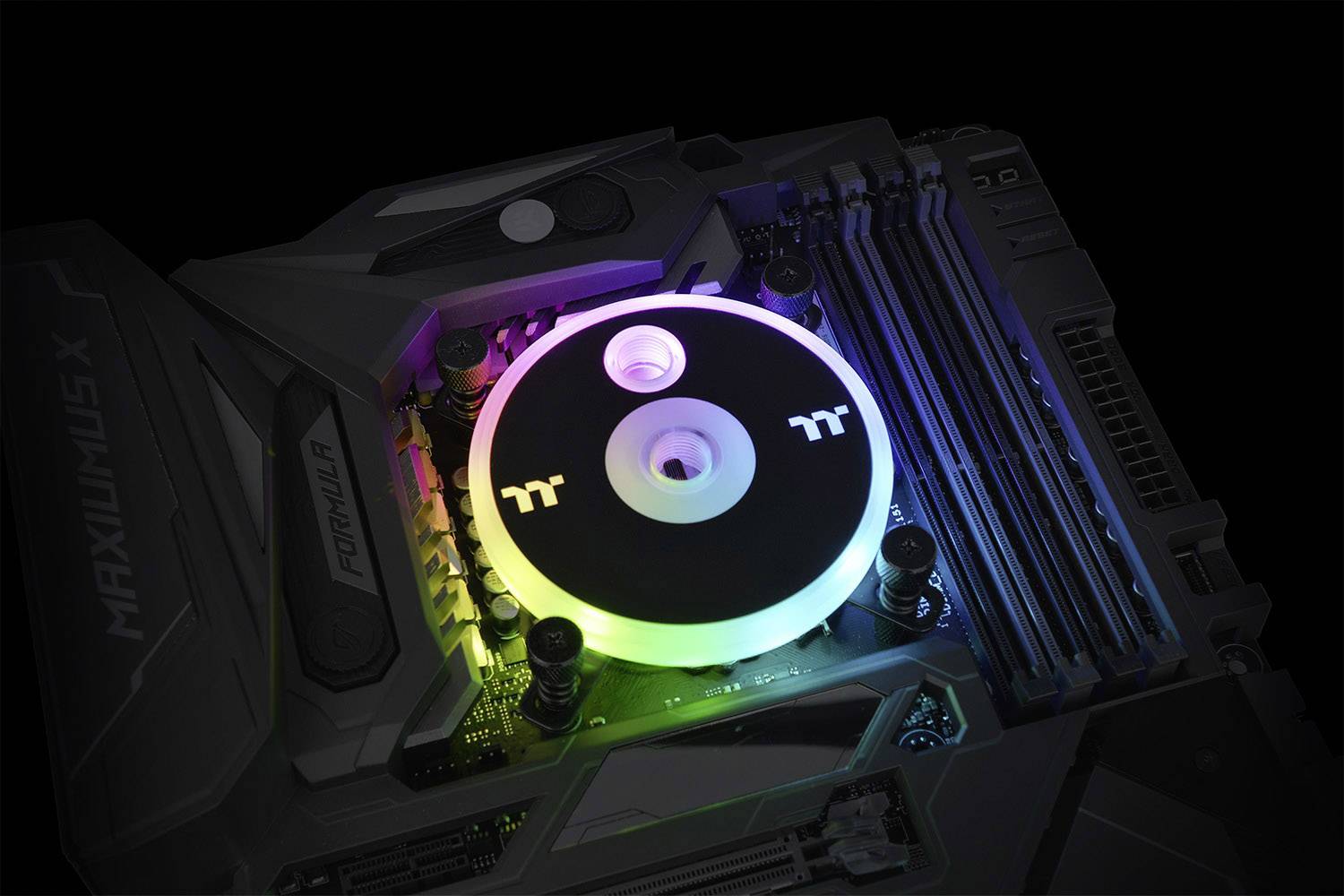A computer processor with a fan that glows in different colours is installed on a motherboard.