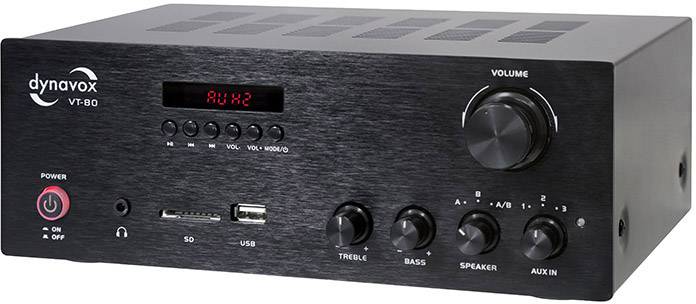A black amplifier with volume control, multiple connections and buttons. Display shows 'AUX2'. Brand name in top left corner.