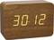 An electronic clock with a wooden casing displays '30:12' in yellow illuminated digits.