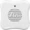A white smoke detector with a green light at the top and a grille in the middle for smoke detection.