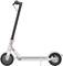 Electric scooter with black handlebars and white frame, side view.