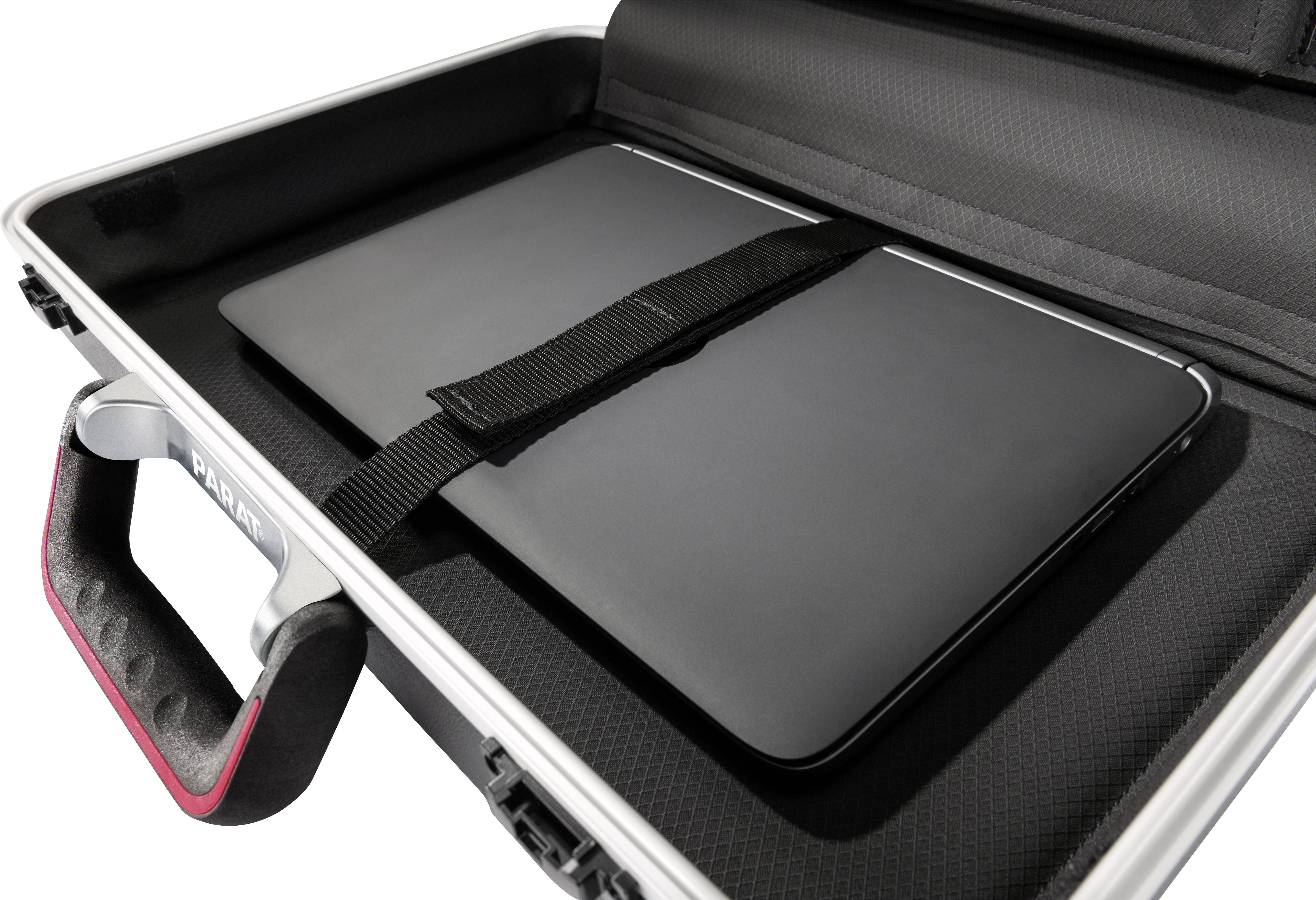 A laptop is securely placed in an open suitcase, which is fastened with a black strap. The handle of the suitcase reads 'PRATT'.