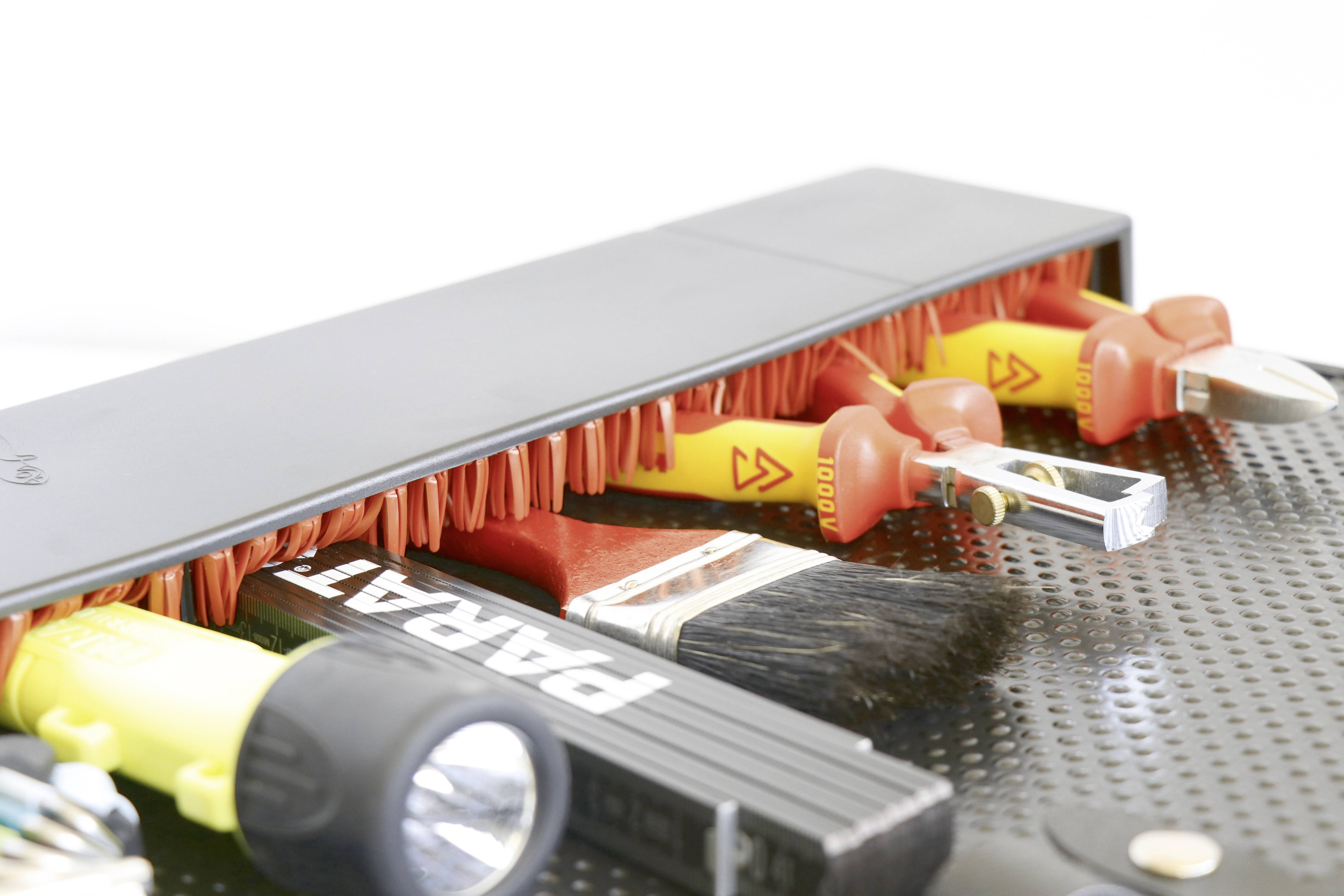 'An open toolbox with various tools, including screwdrivers, a torch and spanners.'