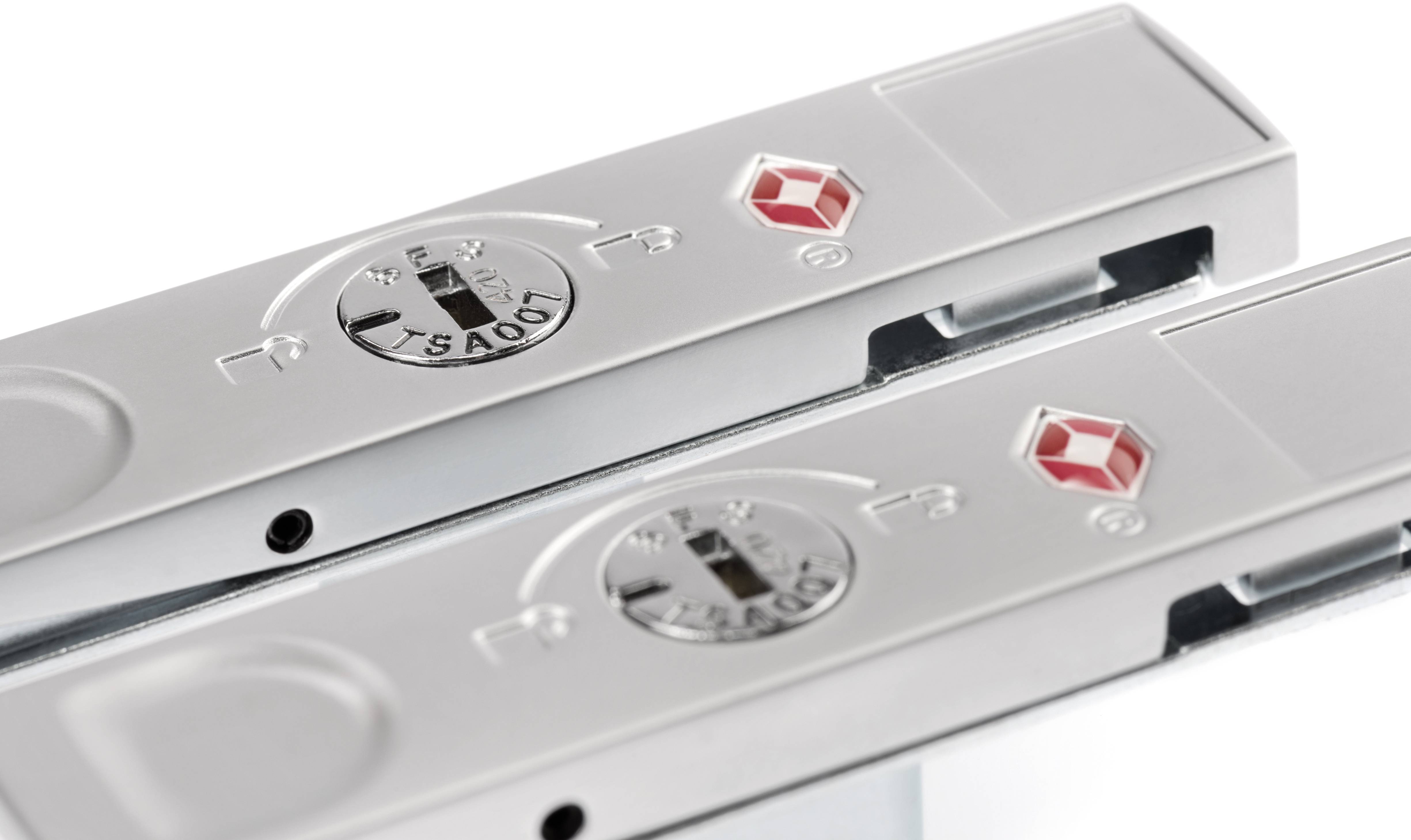 Two silver luggage padlocks with red diamond symbols and number dials.