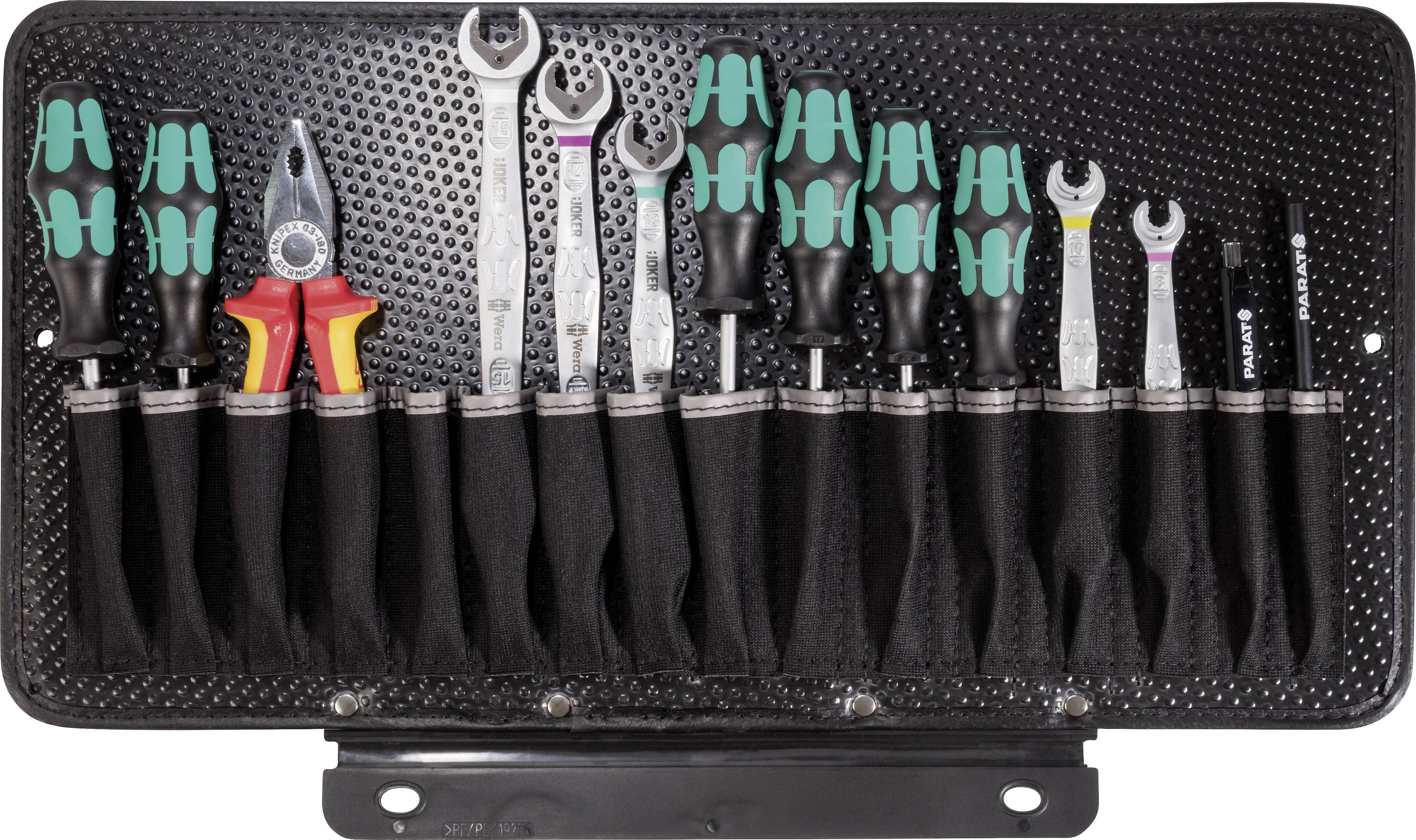 Tool set with screwdrivers, pliers and socket wrenches in a black fabric bag, neatly arranged on a black board.
