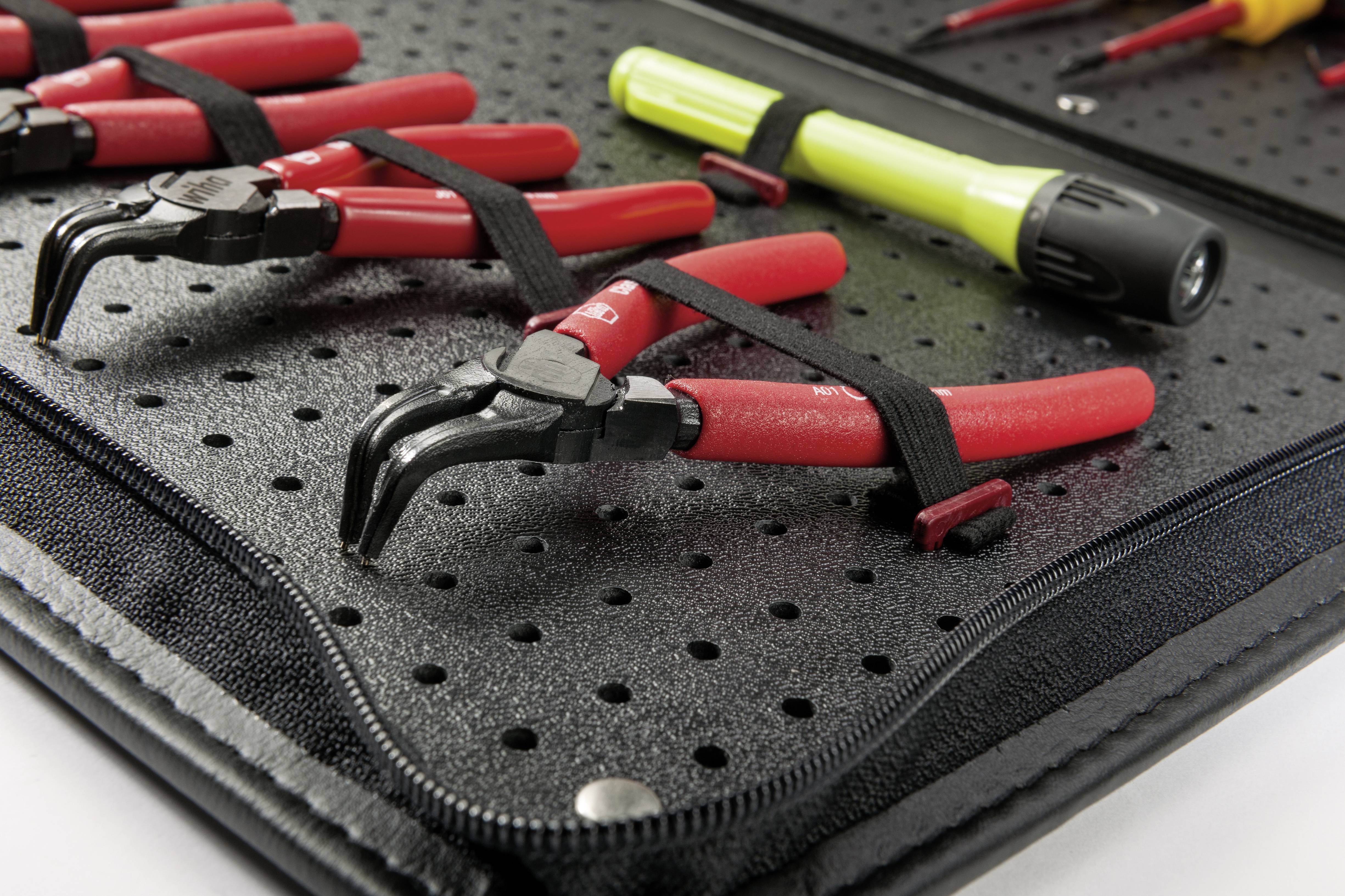 Black tool case with red pliers and yellow screwdriver, all securely fastened.