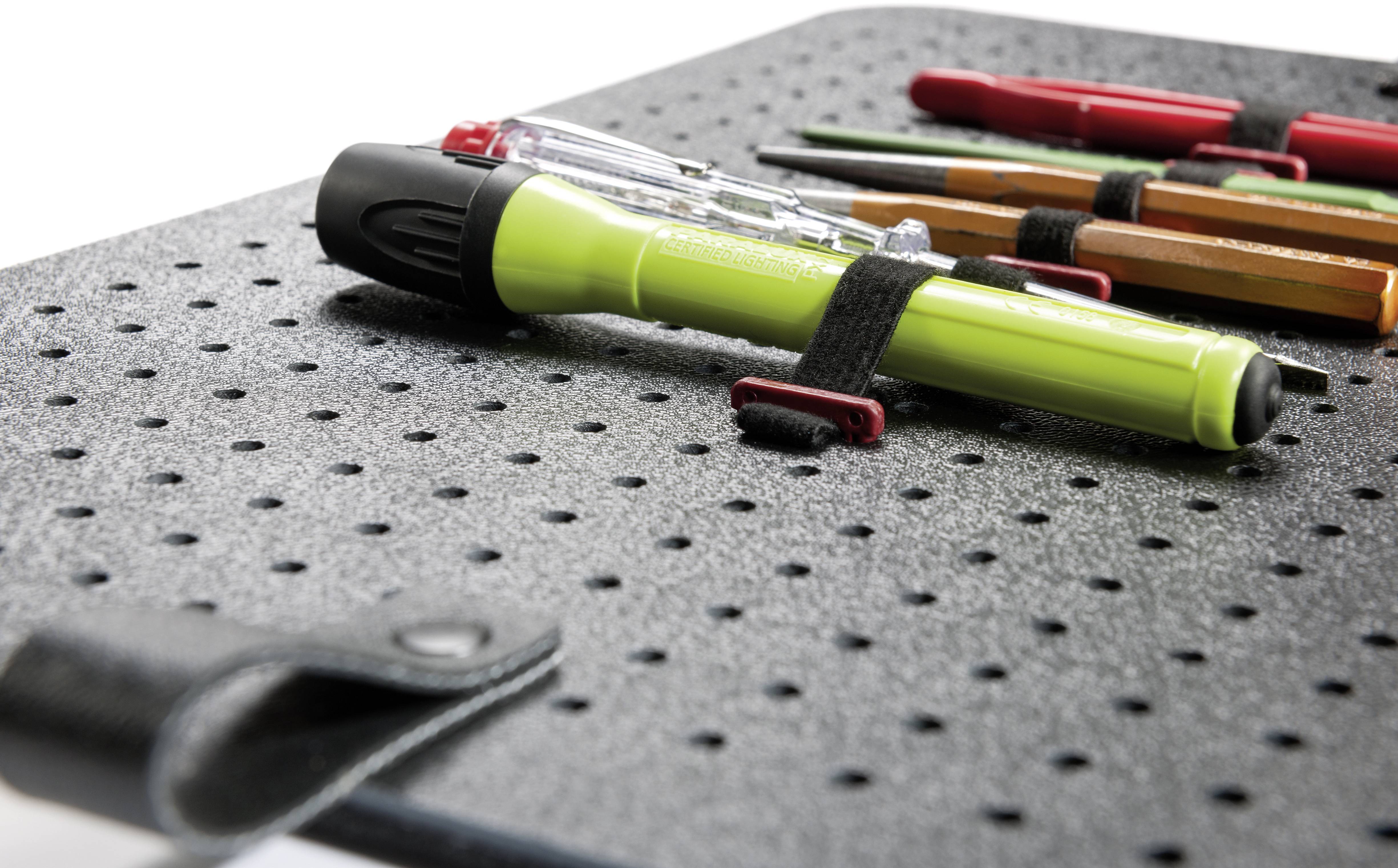 'The image depicts a rotatable board with several pens, including a fluorescent pen, secured with elastic bands.'