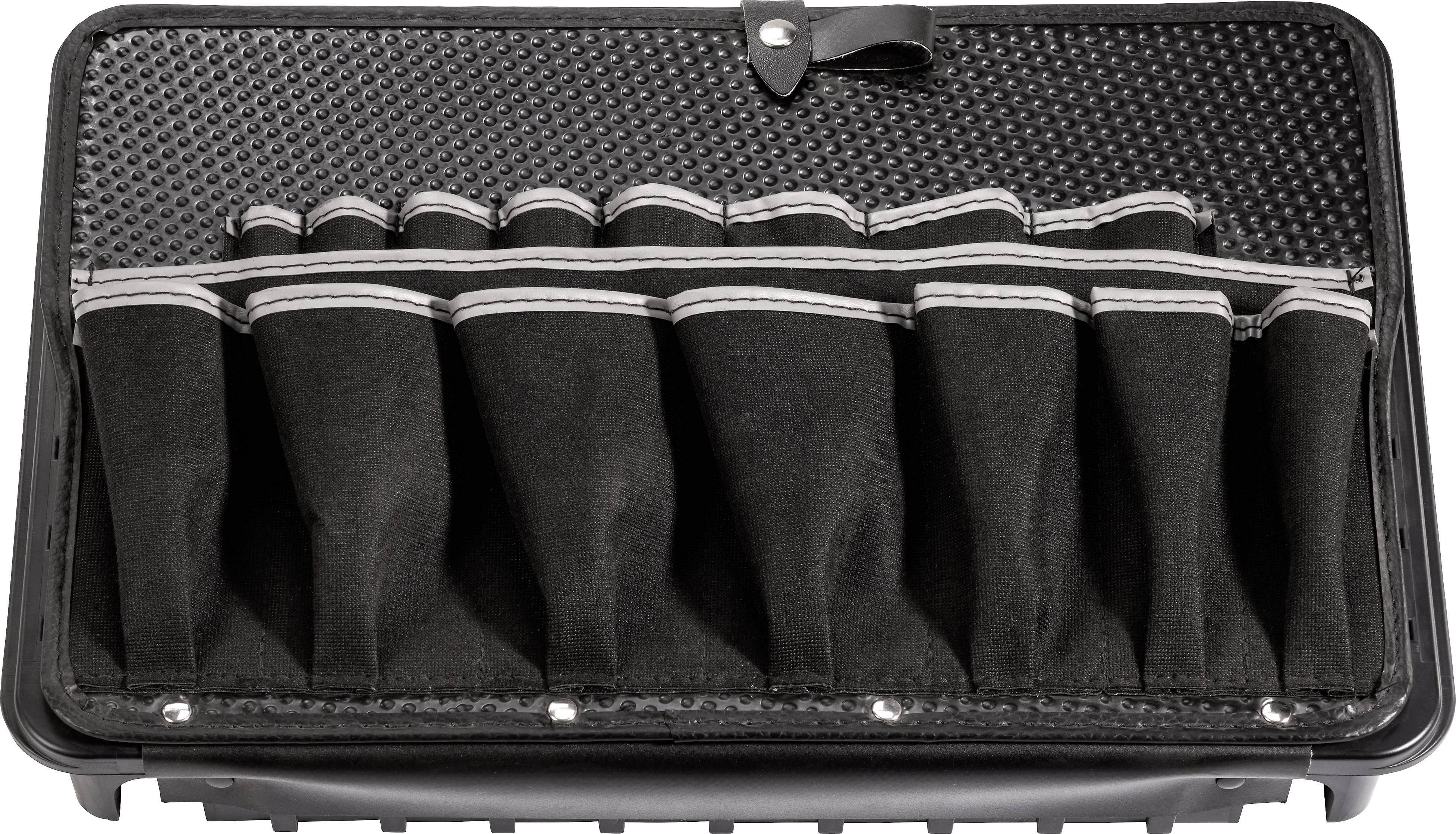 Black tool bag with multiple compartments, partially filled, lying on a textured surface.