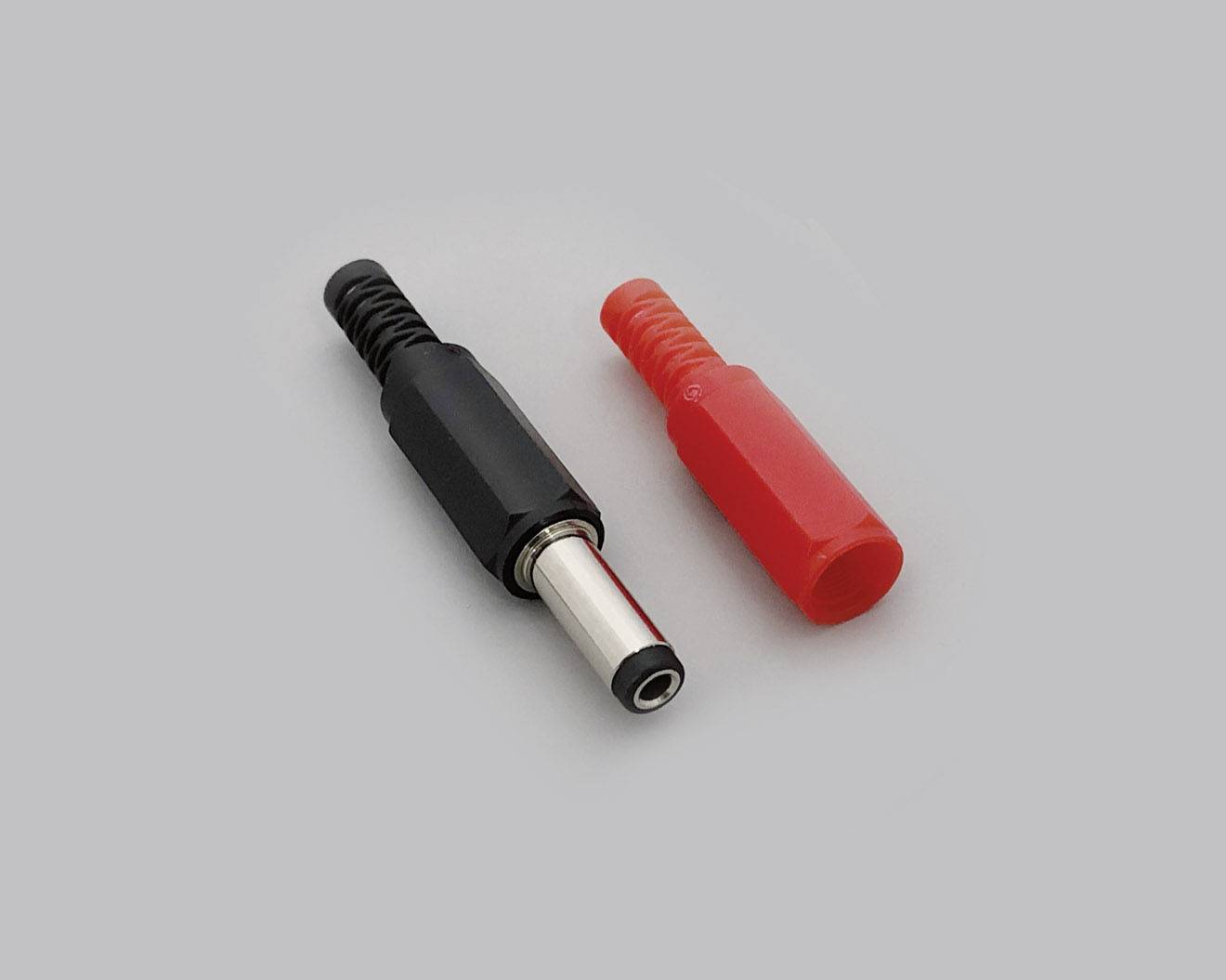 A black and red banana plug on a grey background, used for electrical connection in technical applications.