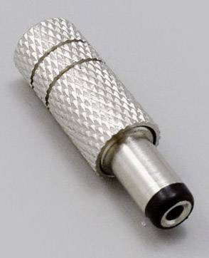 A silver metal plug with a ridged surface and black end lies at an angle on a grey surface.