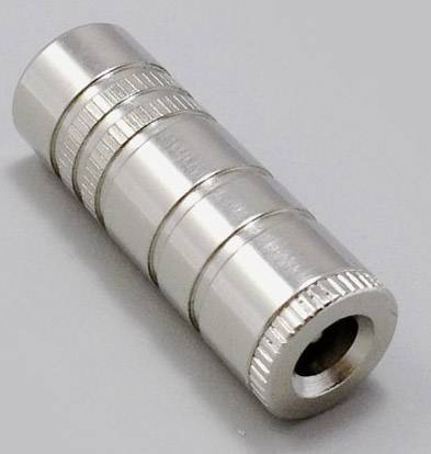 A silver cylindrical metal adapter with ridged rings on a grey surface.