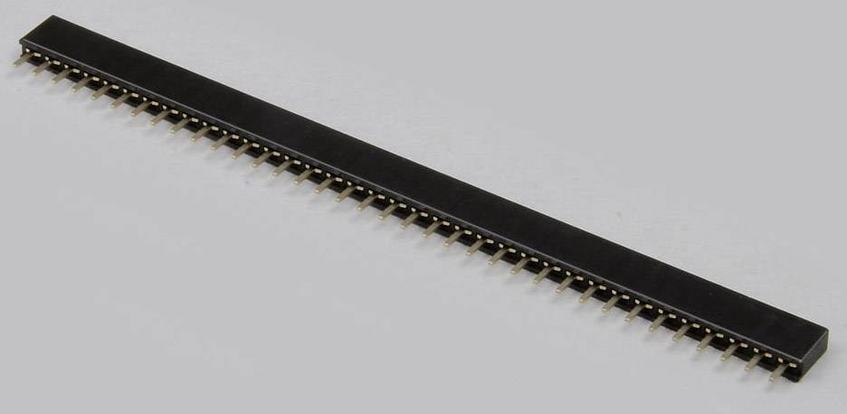 Long black pin header connector with multiple golden pins in a row, lying on a grey background.