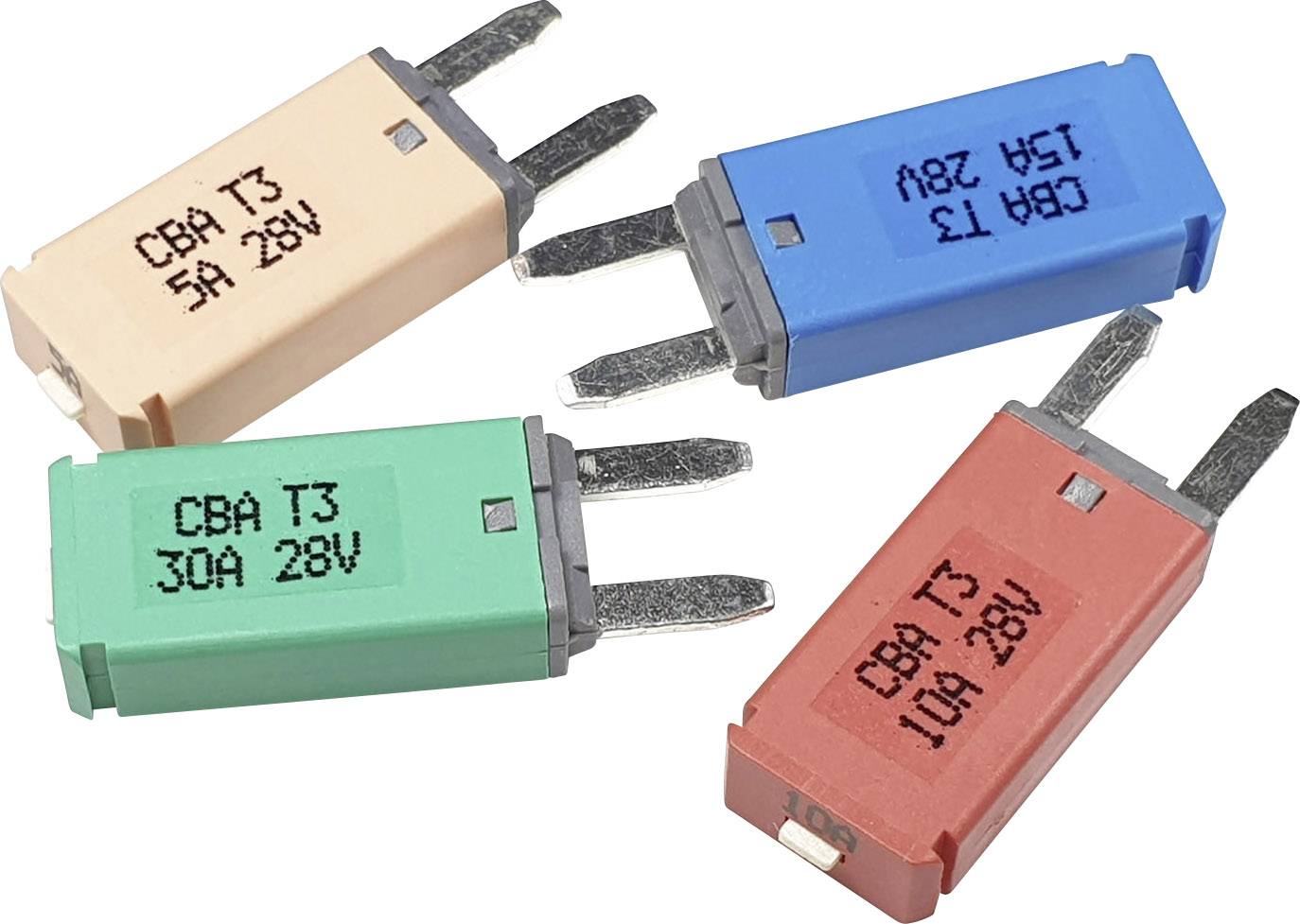 Four flat fuses in different colours (beige, blue, green, red) with markings indicating amperage and voltage.