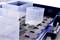 Several transparent plastic containers in a storage system, serving to maintain order and organisation of various items.