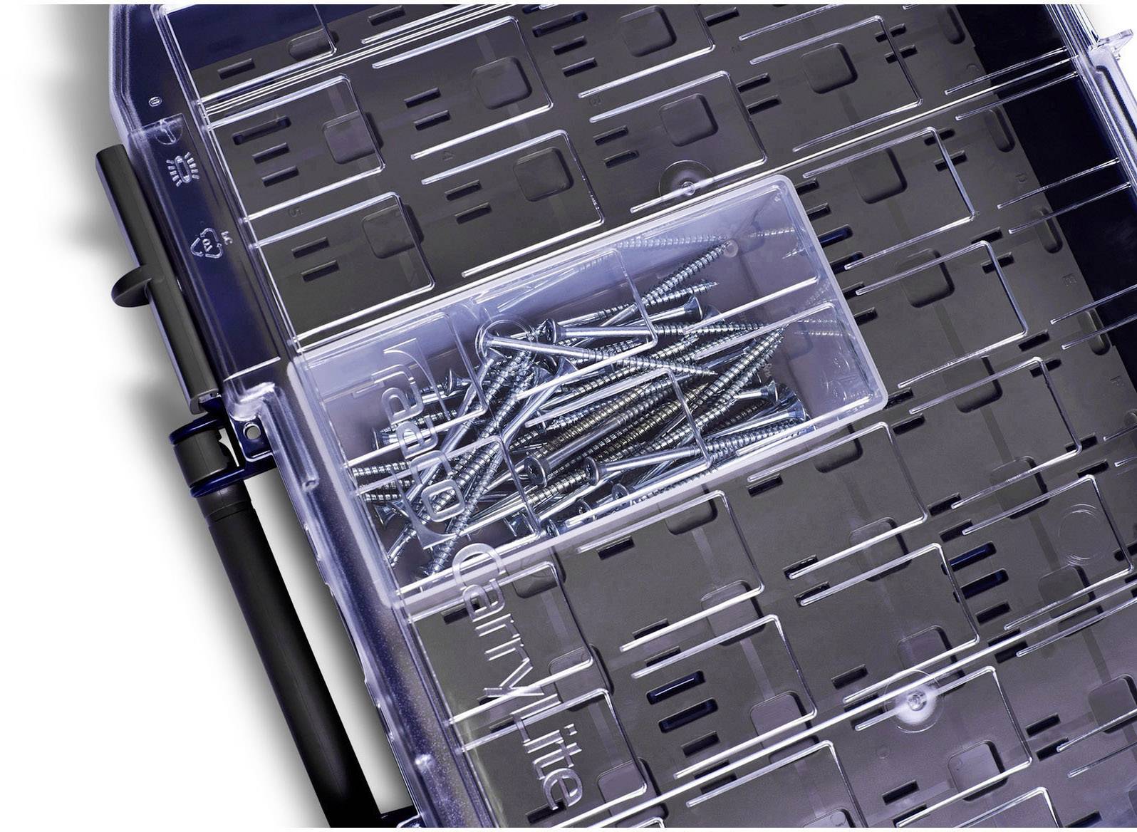A transparent plastic box with several steel screws inside, lying open on a table.