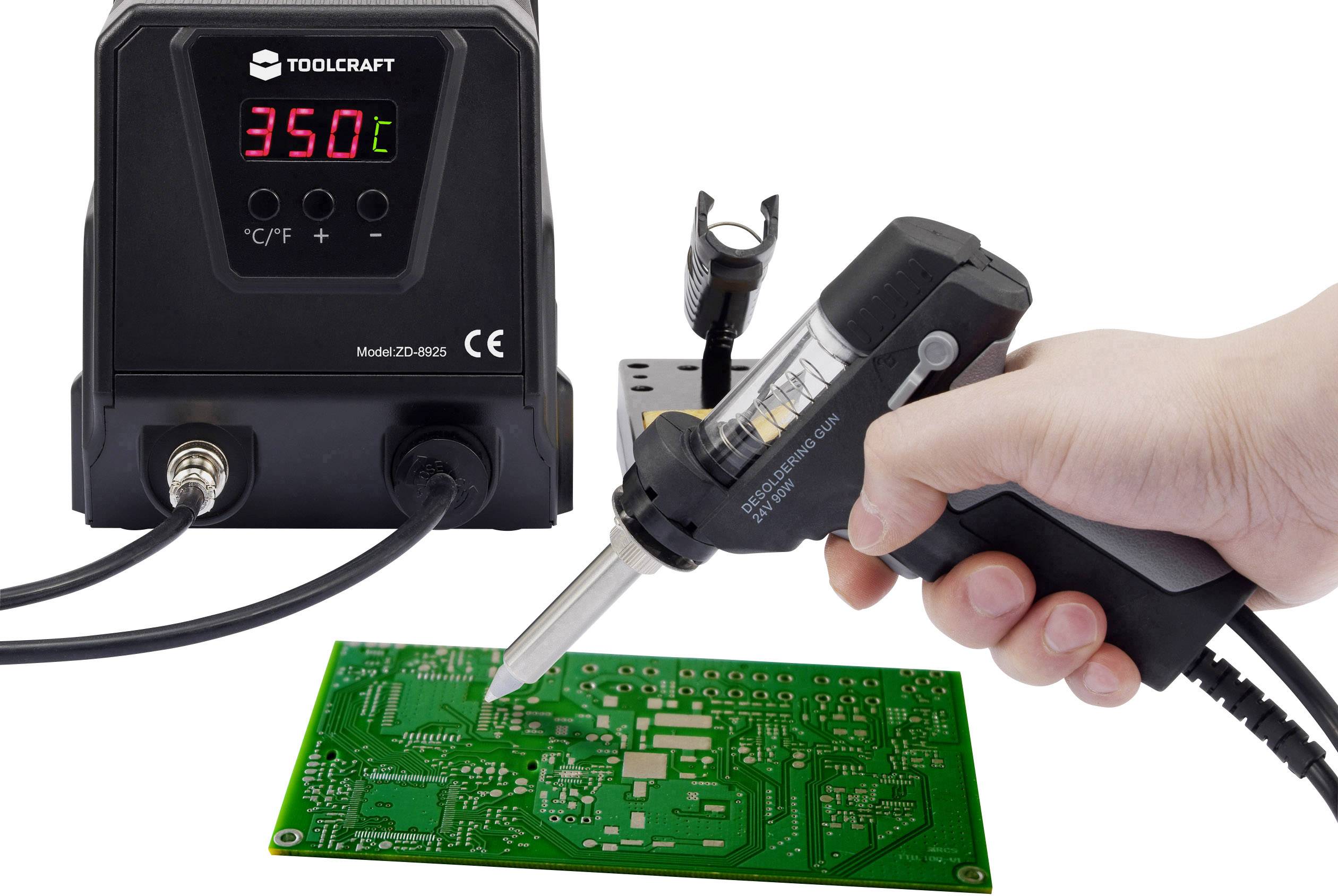 A hand holds a soldering iron over a circuit board. In the background, a digital display shows a temperature of 350°C.