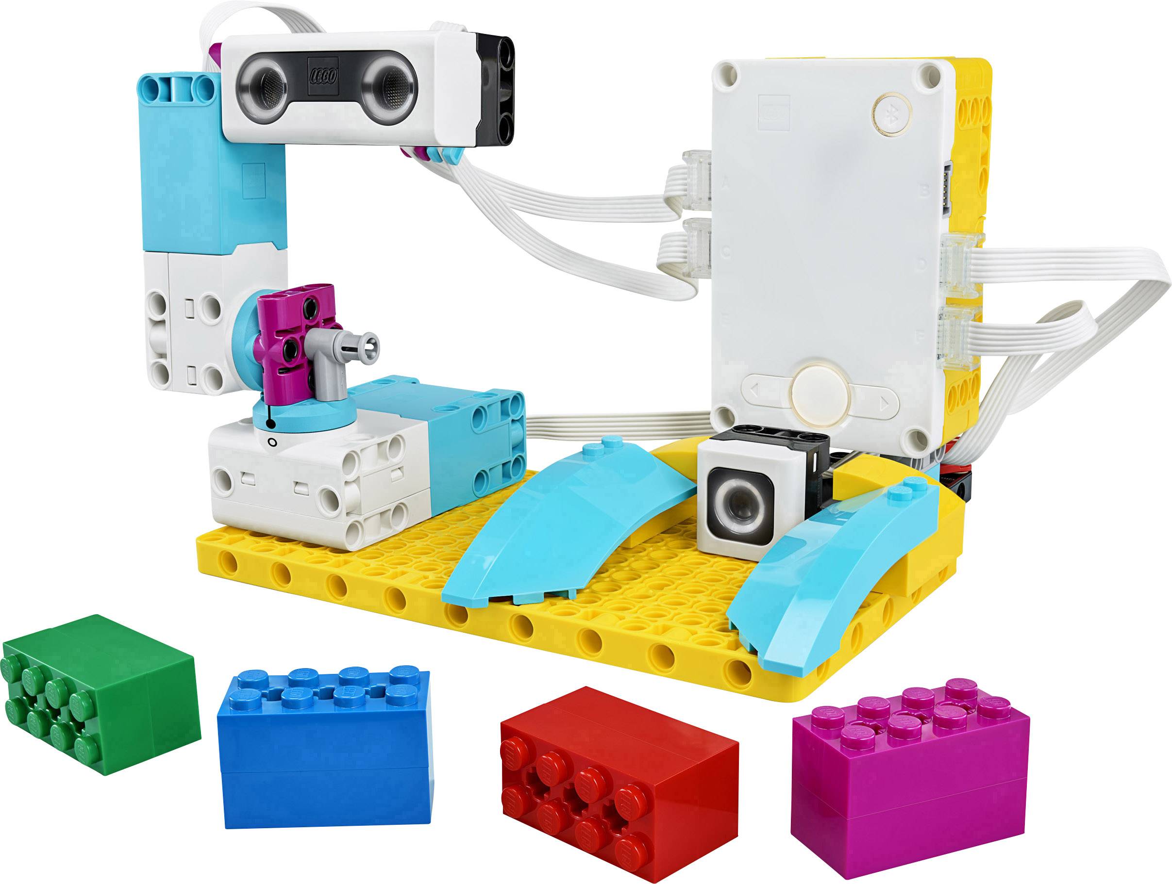 A learning set of programmable, colourful building blocks and motors, displayed on a yellow board. Includes sensors and cables.