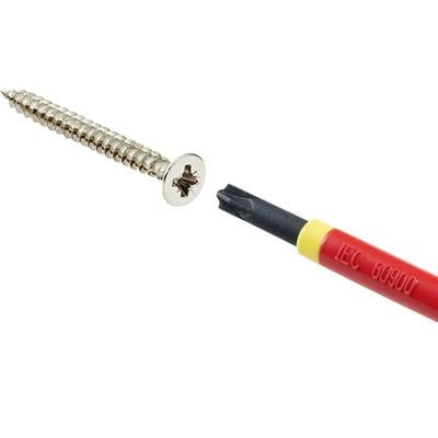 A cross-head screwdriver in red and yellow (marked with 'IEC 60900') next to a golden woodscrew.