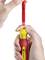A hand is holding a red and yellow screwdriver, while another hand is inserting a red attachment.