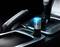 An air purifier sits in the centre console of a car, illuminated in blue light, next to the gear stick.
