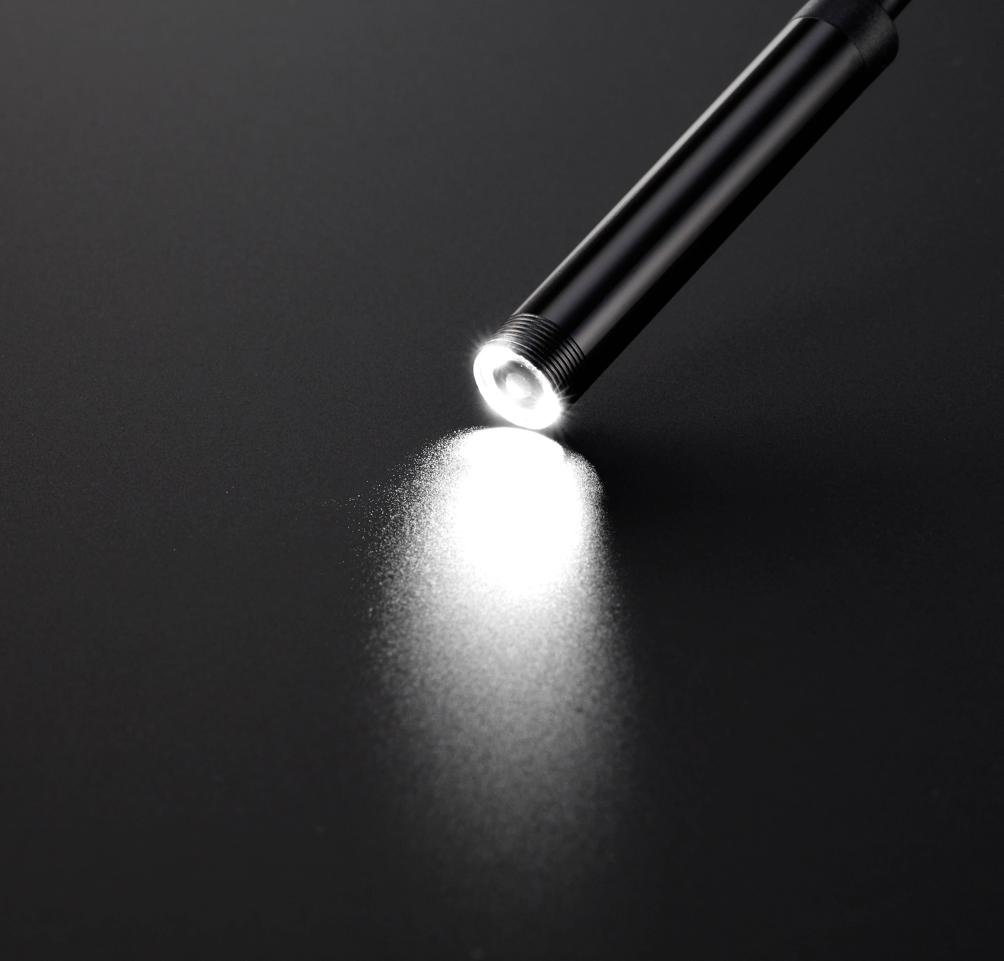 Black torch illuminates a dark surface and creates a white circle of light.