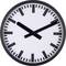 Analogue clock with a black border and a dial without numbers. Time shows three o'clock.