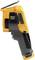 Fluke thermal imaging camera, side view. Grey handle with yellow casing, display folded out. Used for temperature measurements.