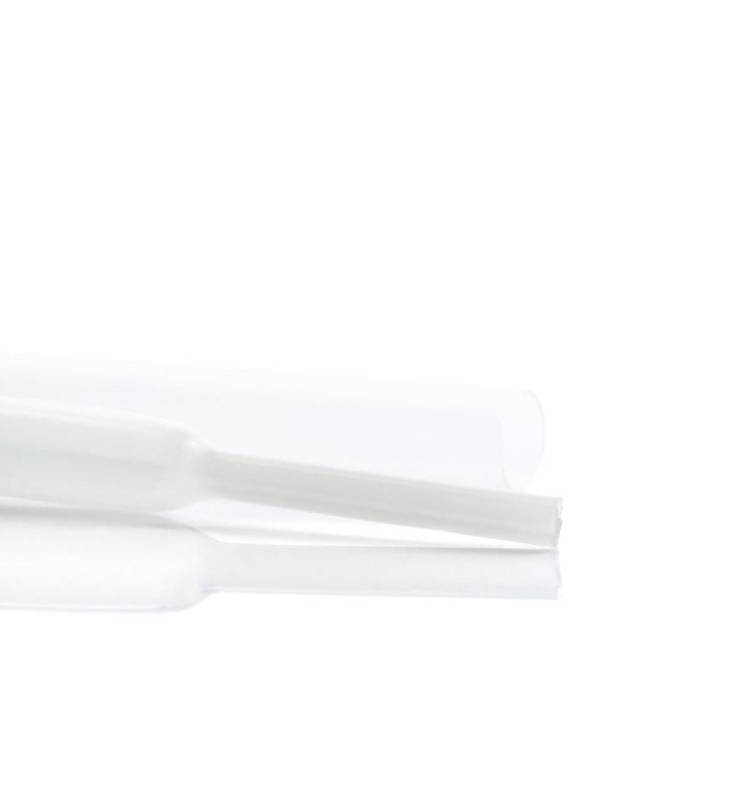 A transparent plastic tube with a cut-off end, lying on a white background.
