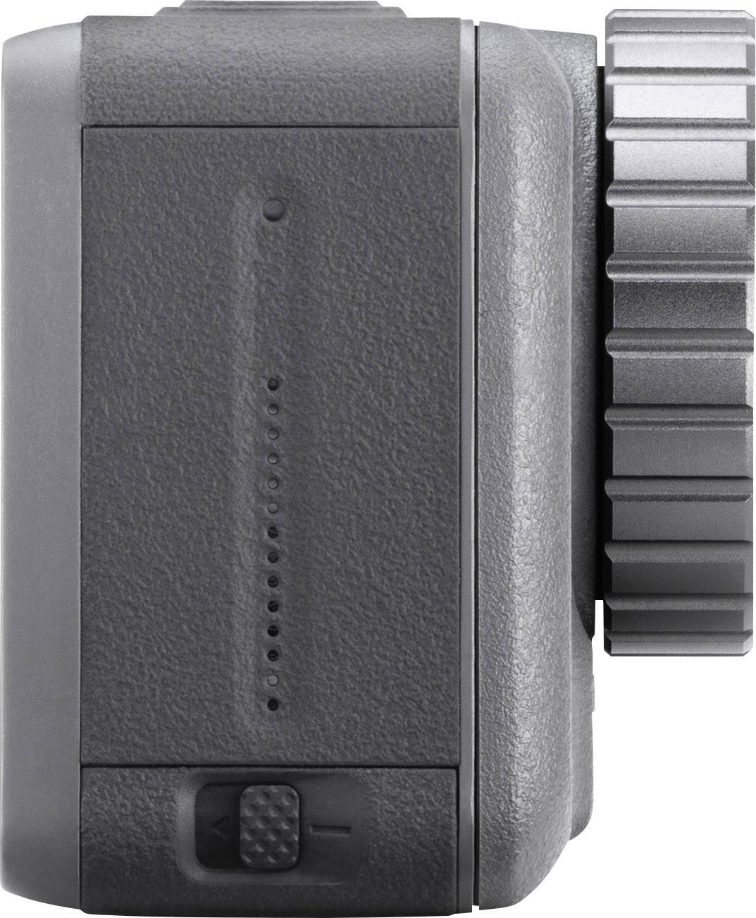 Grey, square camera or device side with textured casing and rotary dial.