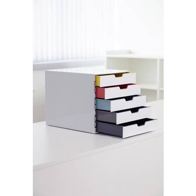 Five-drawer organiser contains colourful, pulled-out drawers for office supplies. Stands on a white table in a bright room.