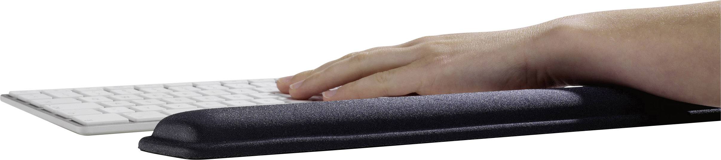 A hand rests on an ergonomic wrist rest in front of a keyboard.