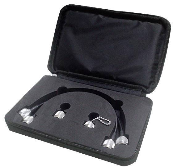A black suitcase contains two black cables with silver connectors and two additional connector pieces nestled in a foam lining.