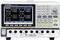 A digital power supply unit with four display indicators, showing voltage, current, and power for four channels.