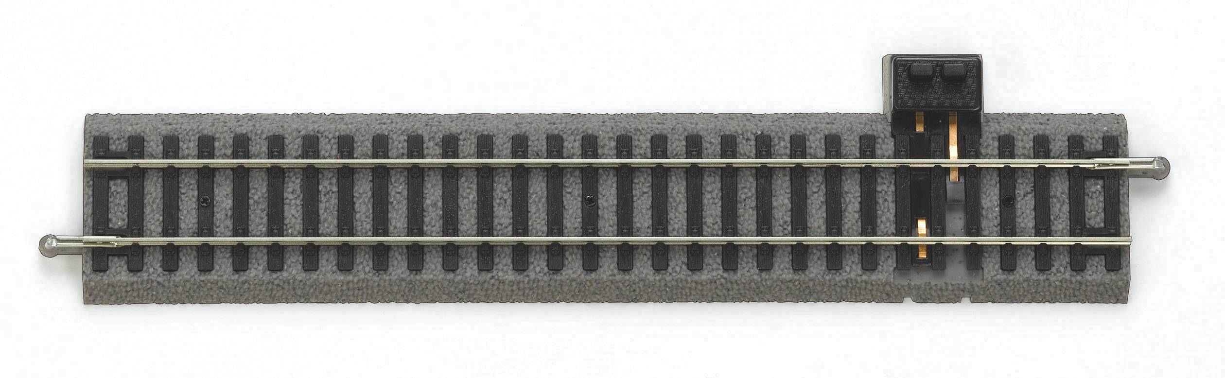 A section of model railway track with ballast bed, electrical connection, and metal rails, viewed from above.
