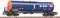 A blue railway tanker with the inscription 'Wasco' is standing on railway tracks. The tank wagon has orange-coloured ends.