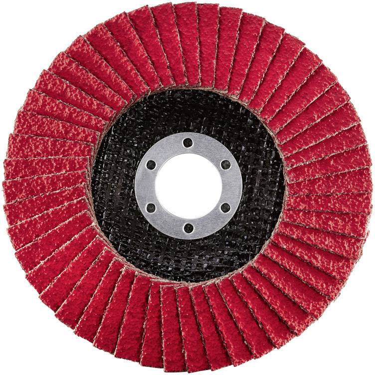 Red grinding disc with radially arranged lamellae and central mounting hole. Suitable for grinding work on metal or wood.