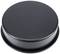 A round, black metal lid, flat and without any visible markings or patterns.