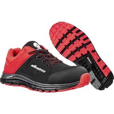 A pair of black and red sports trainers, shown from the side and underneath, with a sturdy sole and distinctive design, suitable for outdoor activities.