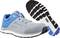 Sports trainer with grey upper material and blue accents, thick black sole. Brand logo visible.