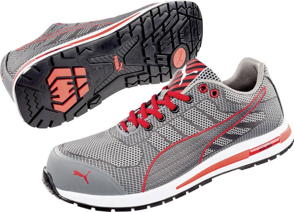 Grey sports trainers with red accents, mesh fabric and brand logo, showing side and sole views. Trainers for athletic activities.