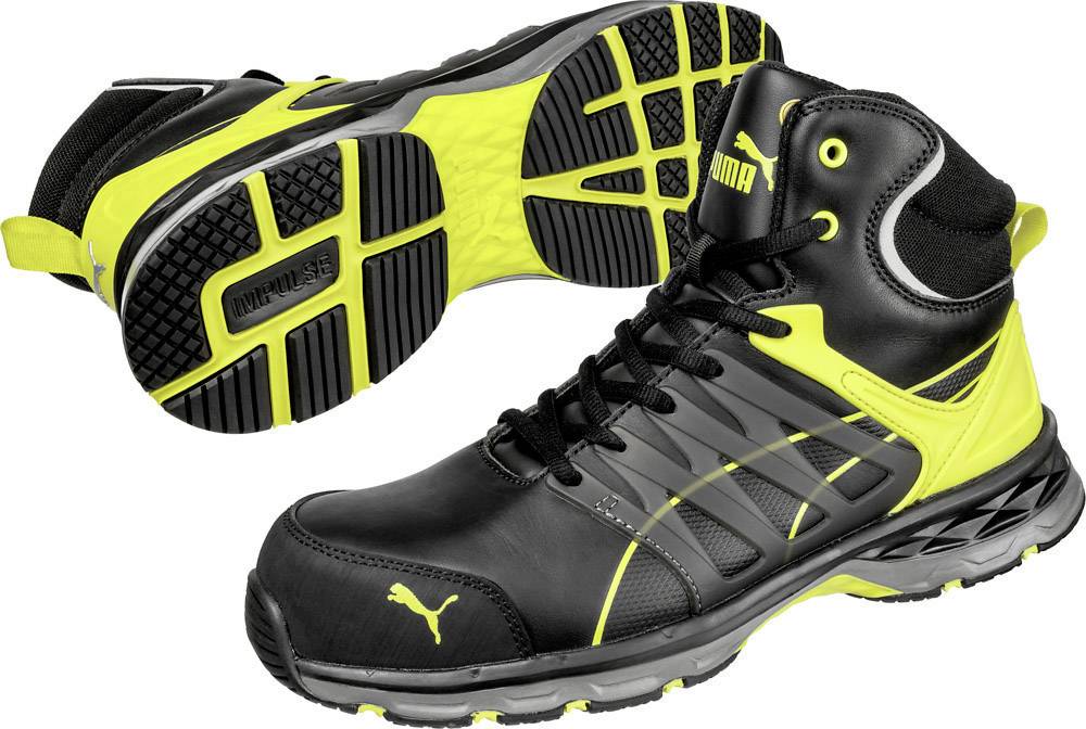 Black and yellow high-top trainers. One shoe sole displays a non-slip texture. Suitable for sporting activities.